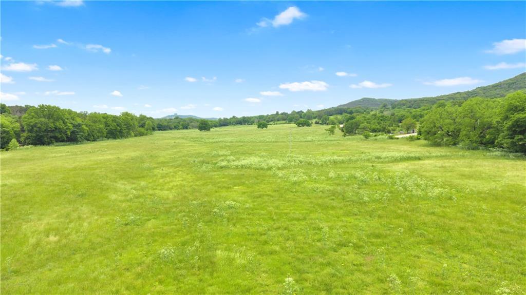 73.64 acre cattle and pasture farm on County Road 425 in Berryville, AR with Big Indian Creek frontage.